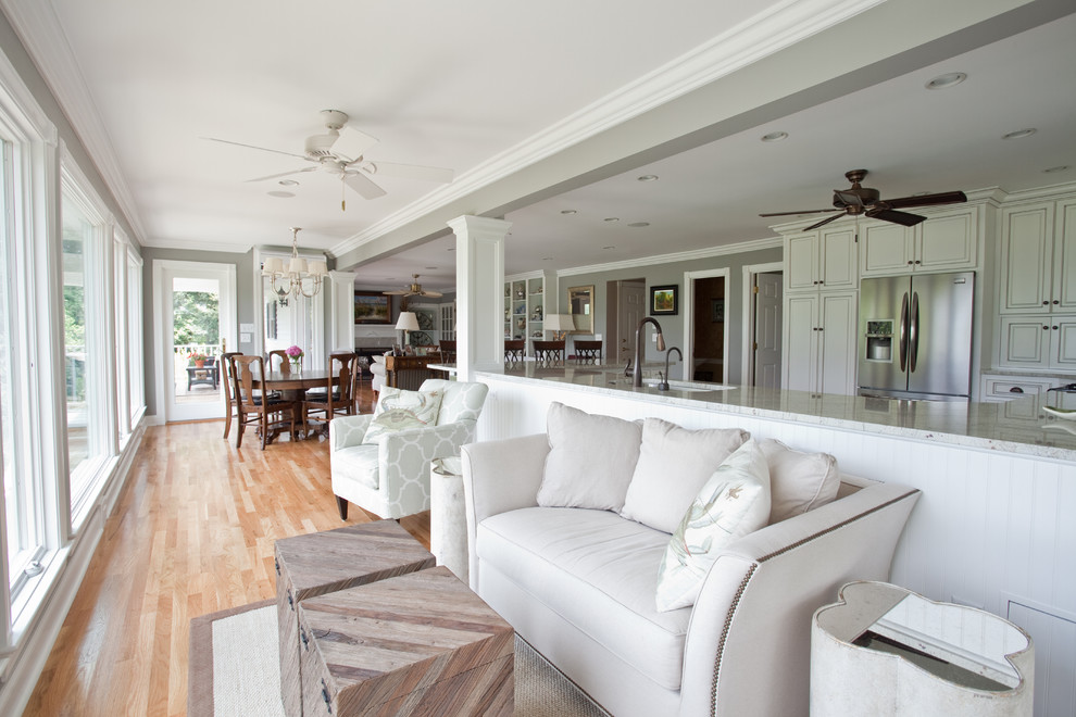 Inspiration for a large world-inspired living room in Charleston with light hardwood flooring.