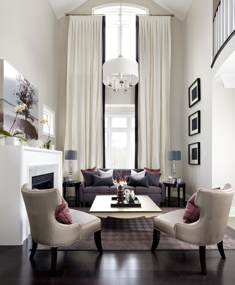 Example of a mid-sized transitional formal living room design in Toronto with beige walls and a standard fireplace