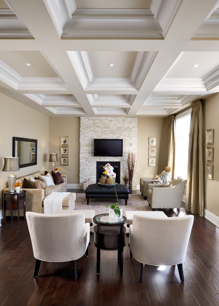 Inspiration for a timeless enclosed brown floor living room remodel in Toronto with a stone fireplace, a standard fireplace and a wall-mounted tv