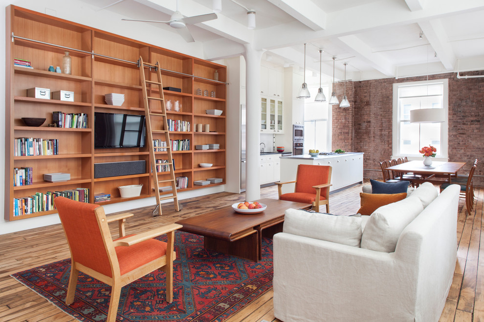 Idee per un soggiorno design aperto con libreria