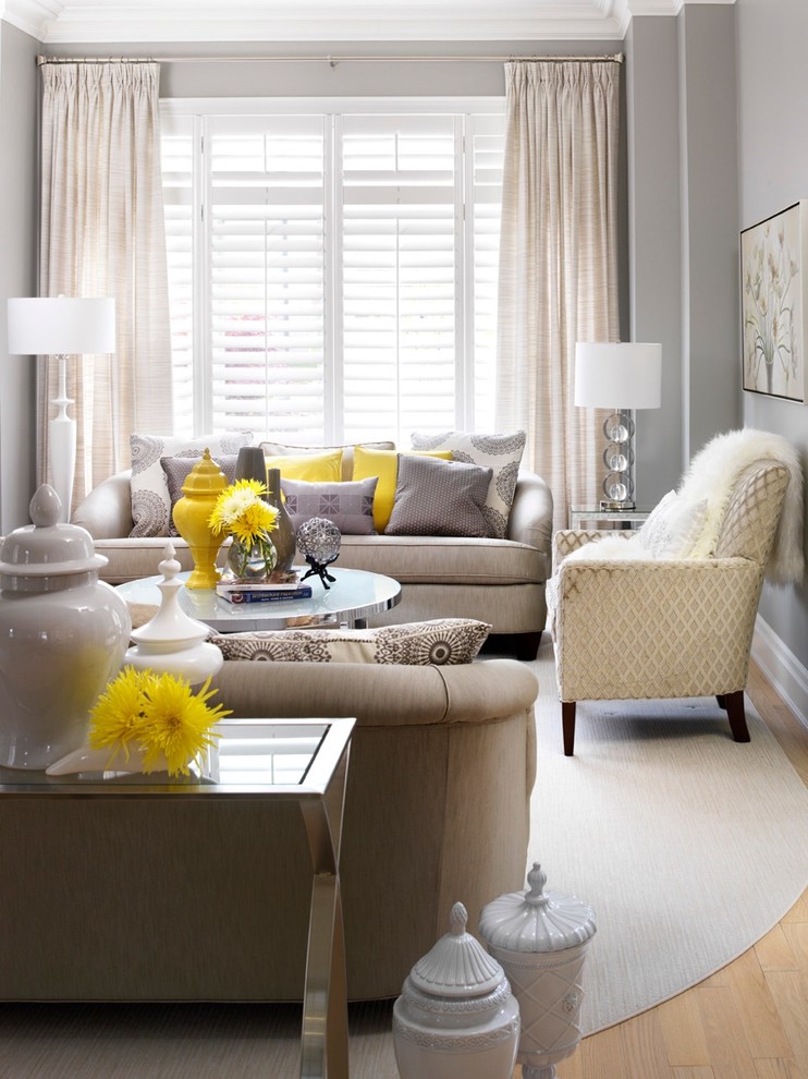 Living room - mid-sized transitional enclosed living room idea in Toronto with gray walls