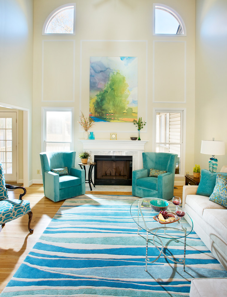 Photo of a medium sized traditional open plan living room in Nashville with green walls, light hardwood flooring, a standard fireplace, a stone fireplace surround, no tv and yellow floors.