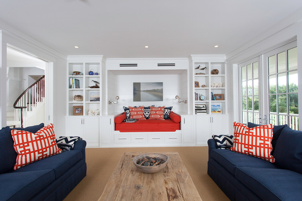 Large beach style enclosed carpeted and beige floor living room photo in Boston with white walls, no fireplace and no tv