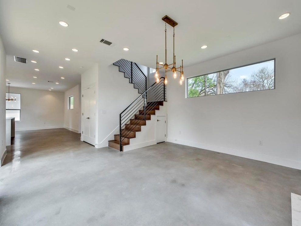 Idéer för att renovera ett stort funkis separat vardagsrum, med ett finrum, vita väggar, betonggolv, en spiselkrans i sten och grått golv