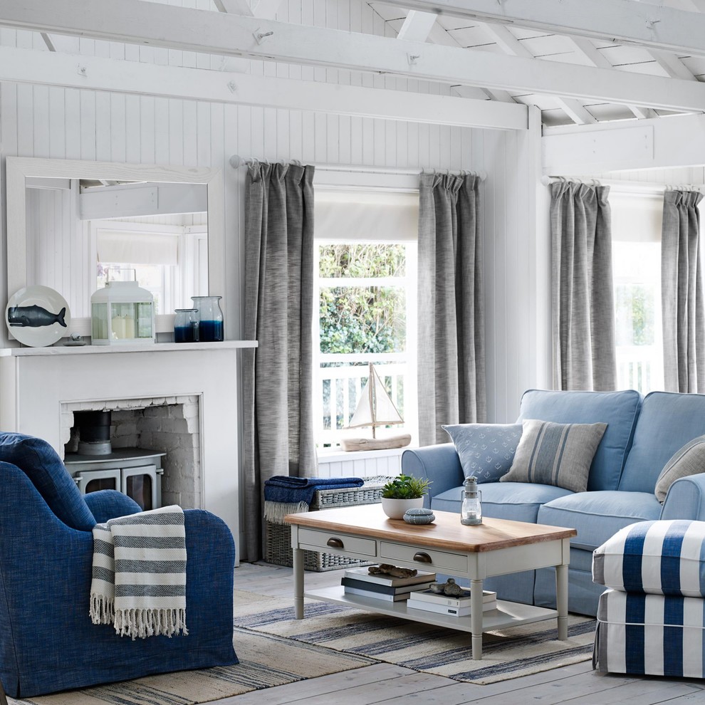 Example of a beach style living room design in London