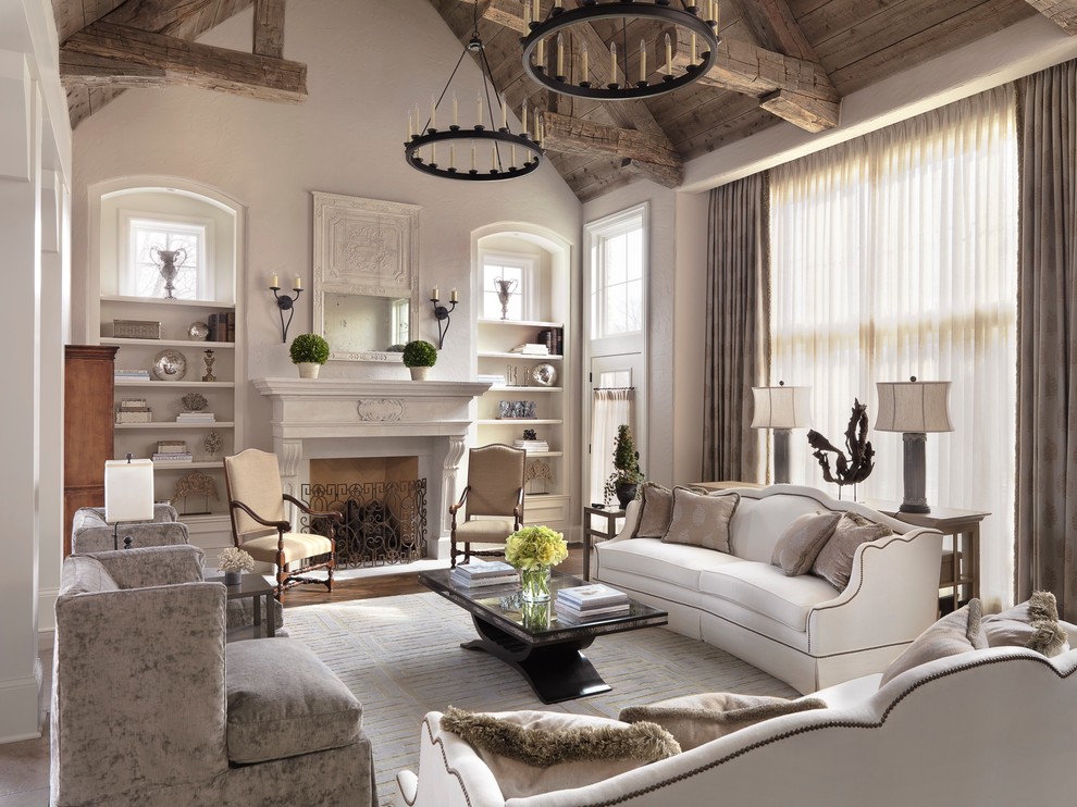 Imagen de salón para visitas clásico con todas las chimeneas y alfombra