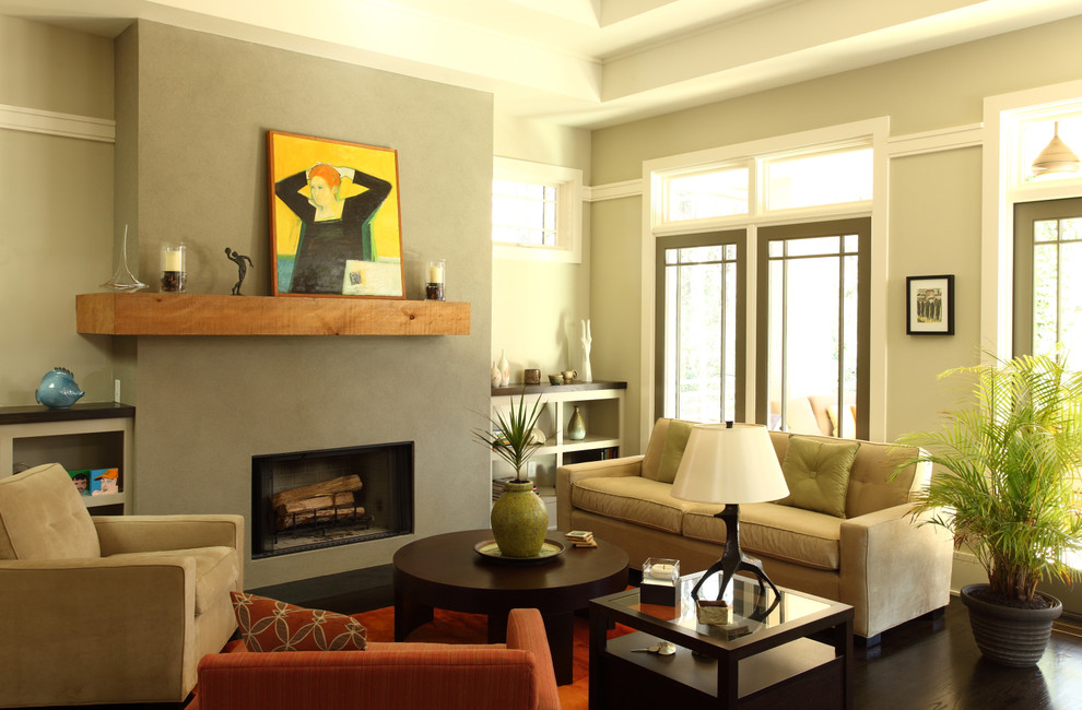 Example of a classic dark wood floor living room design in Atlanta with beige walls, a standard fireplace and no tv