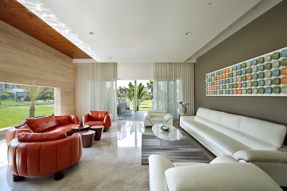 Medium sized contemporary living room in Ahmedabad with beige floors.