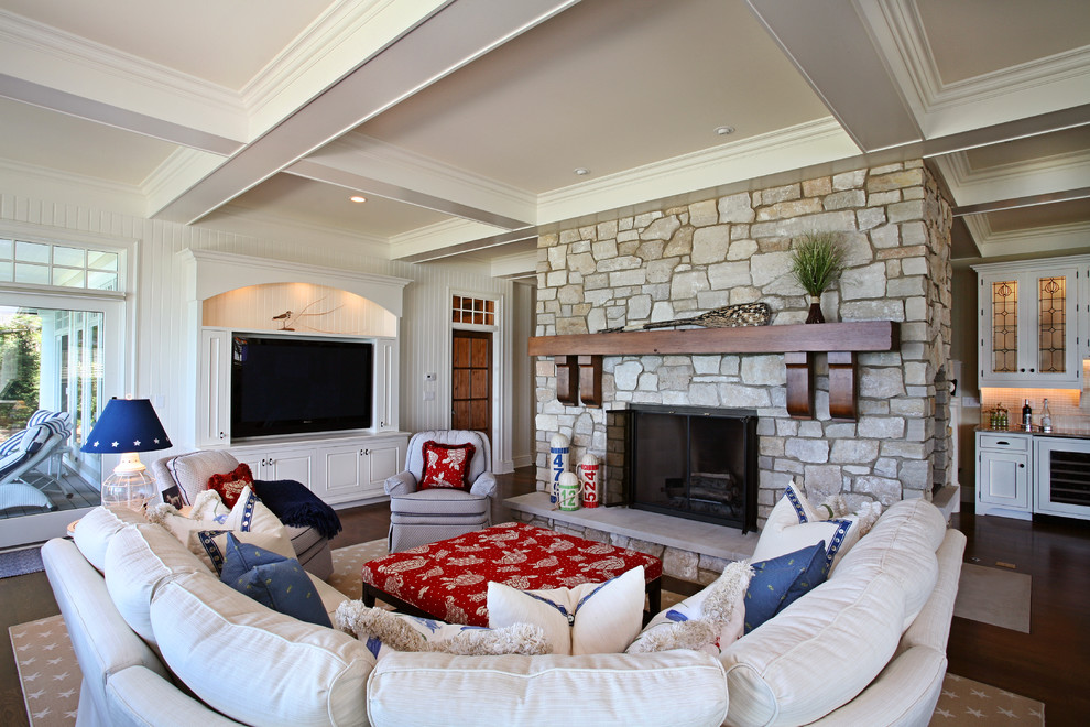 Inspiration for a large contemporary open concept dark wood floor living room remodel in Grand Rapids with beige walls, a standard fireplace, a stone fireplace and a wall-mounted tv
