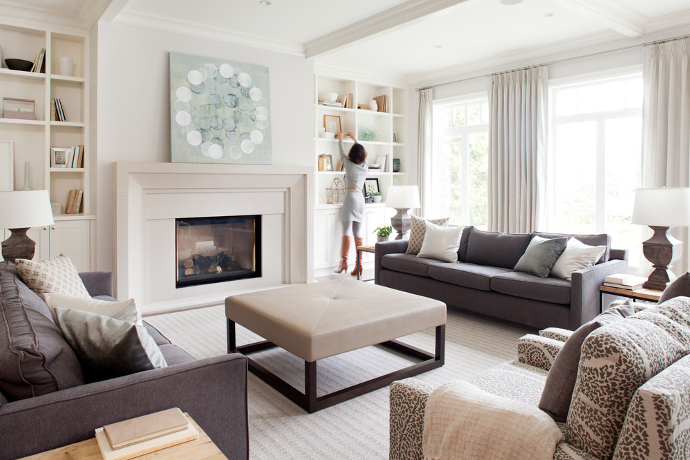 Example of a trendy open concept light wood floor living room design in Vancouver with gray walls, a standard fireplace and a concrete fireplace