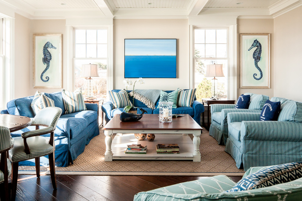 Coastal formal living room in Portland Maine with beige walls and dark hardwood flooring.