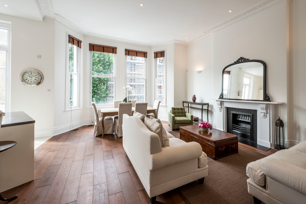 Design ideas for a classic open plan living room in London.