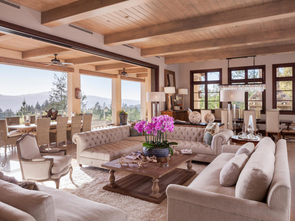 Living room - mid-sized contemporary formal and enclosed medium tone wood floor and brown floor living room idea in San Francisco with beige walls, a standard fireplace, a stone fireplace and a wall-mounted tv