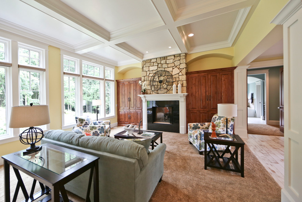Inspiration for a large timeless open concept and formal carpeted and gray floor living room remodel in Grand Rapids with yellow walls, a standard fireplace, a wood fireplace surround and no tv