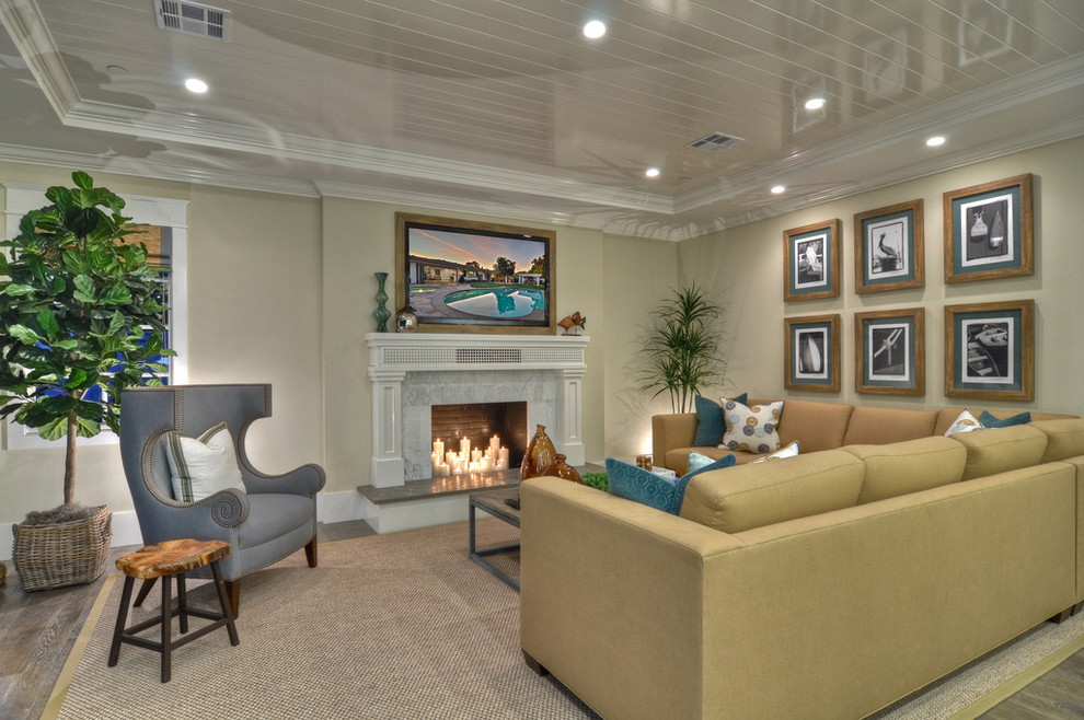 Living room - transitional living room idea in Orange County with beige walls and a standard fireplace