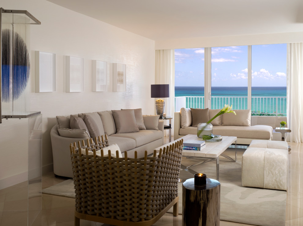Photo of a contemporary living room in Miami with white walls and no tv.