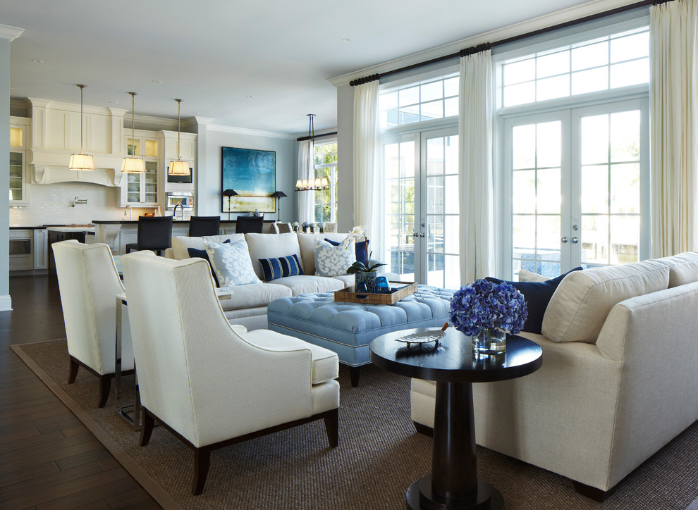 This is an example of a large traditional formal open plan living room in Miami with no fireplace, grey walls and dark hardwood flooring.