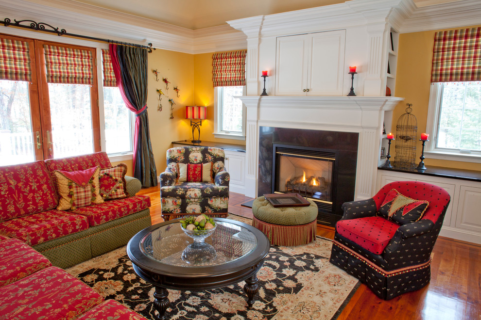 Design ideas for a bohemian living room in Boston with yellow walls and a standard fireplace.