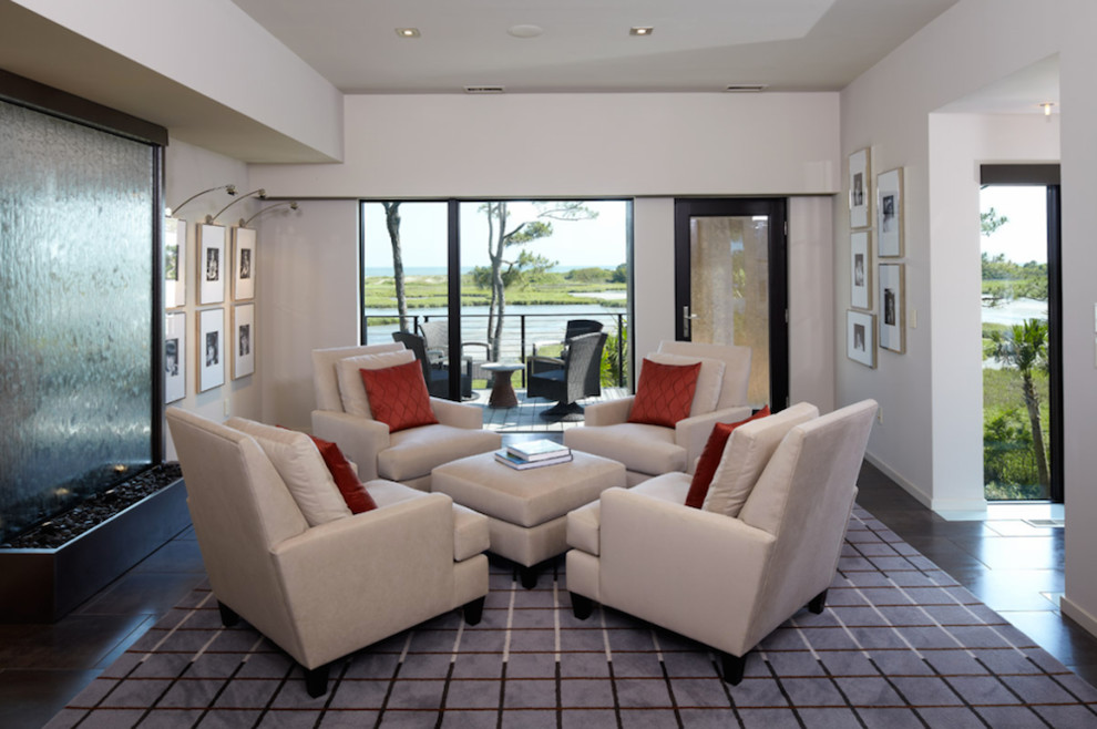 Ejemplo de salón abierto contemporáneo de tamaño medio sin chimenea con paredes blancas, moqueta y televisor independiente