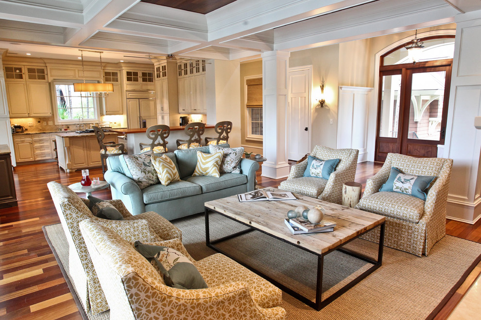 Example of a beach style open concept living room design in Charleston with gray walls