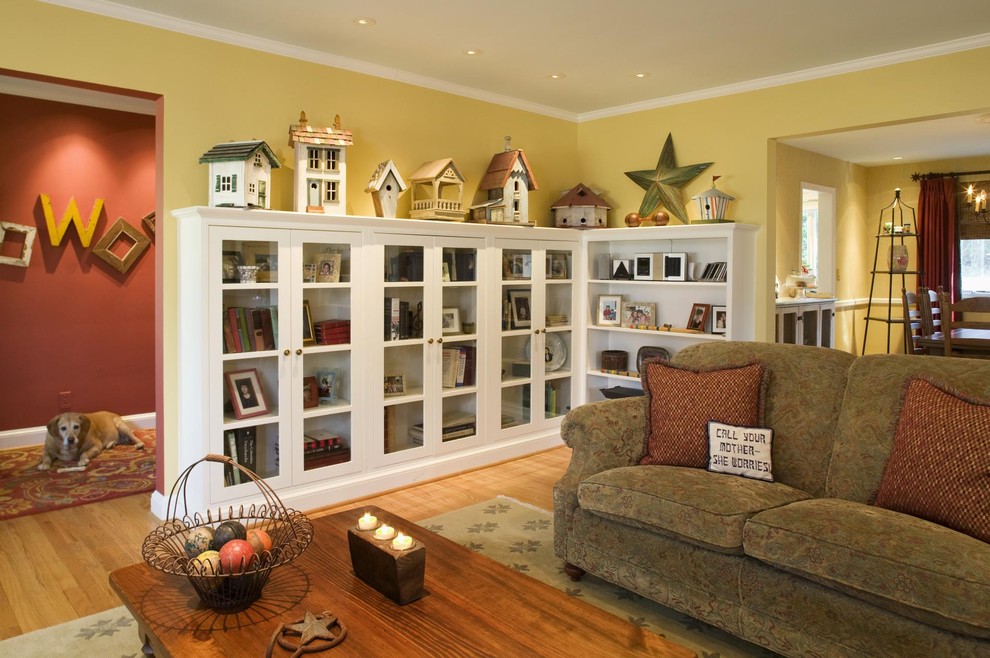 Living room - mid-sized eclectic enclosed light wood floor and brown floor living room idea in DC Metro with yellow walls and no tv