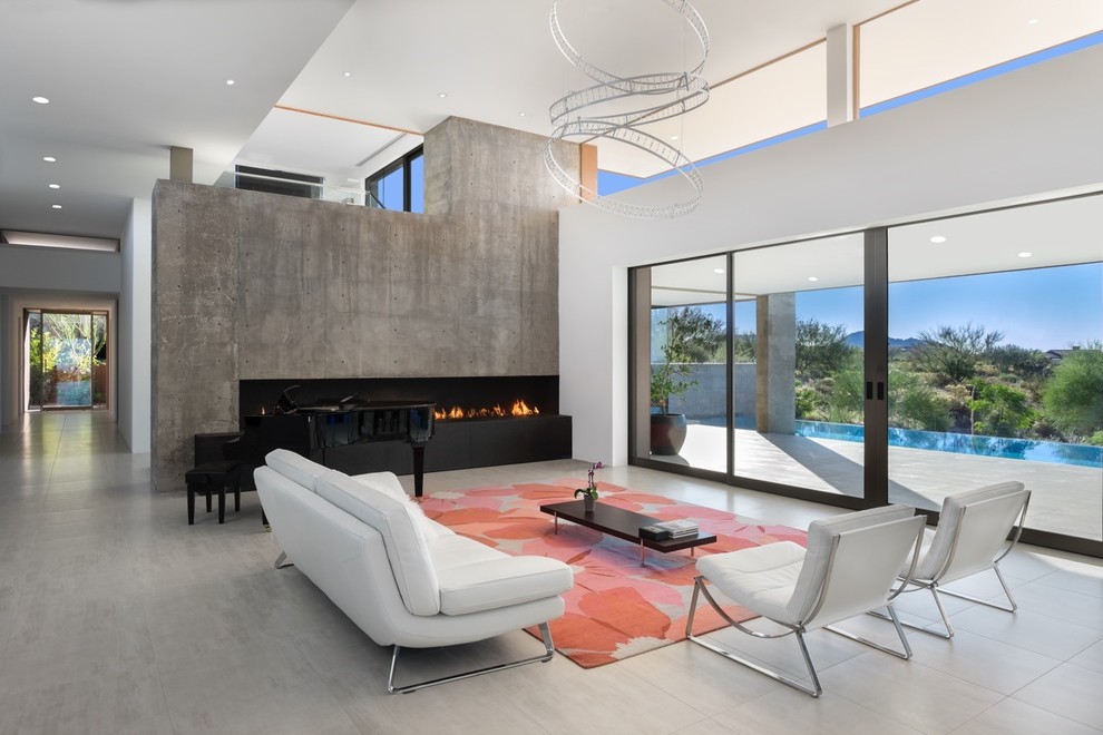 Living room - large southwestern open concept and formal concrete floor and gray floor living room idea in Phoenix with white walls, a ribbon fireplace, a concrete fireplace and no tv