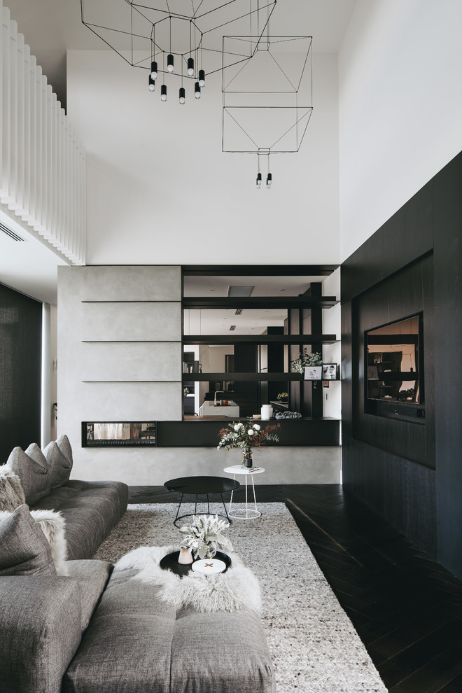 Inspiration for a contemporary dark wood floor and black floor living room remodel in Adelaide with white walls, a two-sided fireplace and a wall-mounted tv