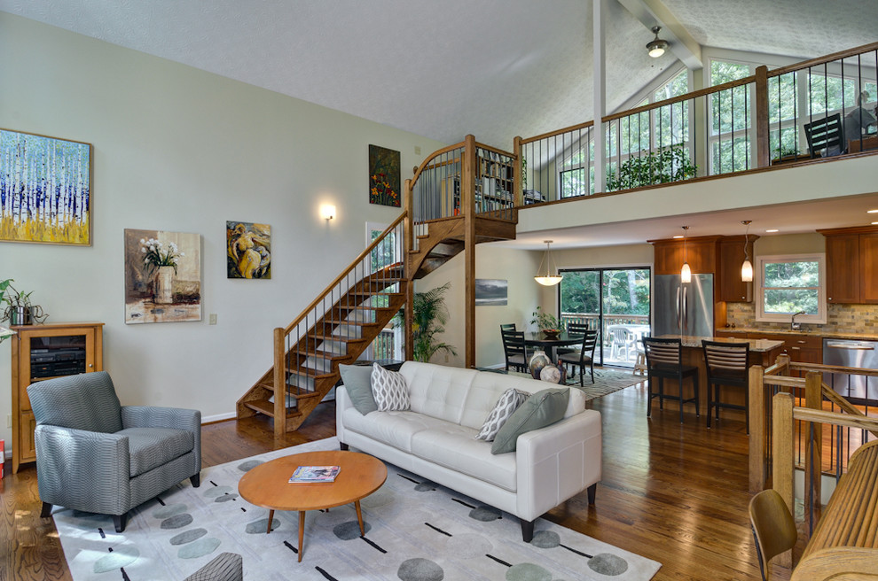 Example of an eclectic open concept dark wood floor living room design in Atlanta