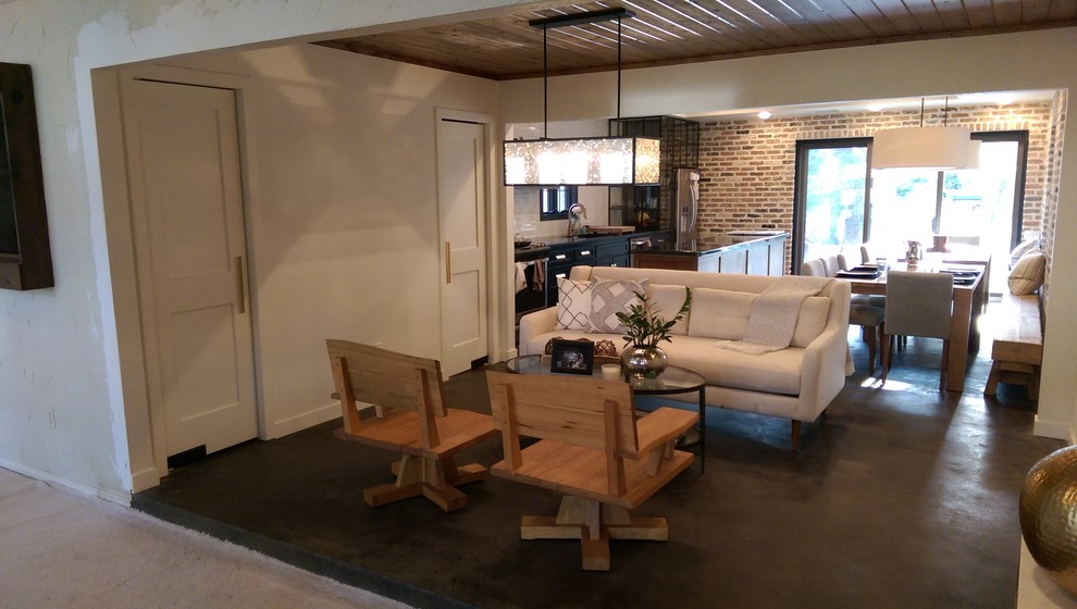 This is an example of a medium sized traditional formal open plan living room in Dallas with no tv, white walls, concrete flooring and no fireplace.