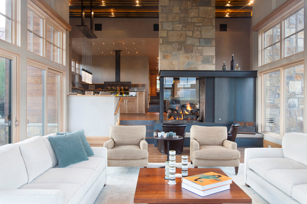 This is an example of a large rustic living room in Denver.
