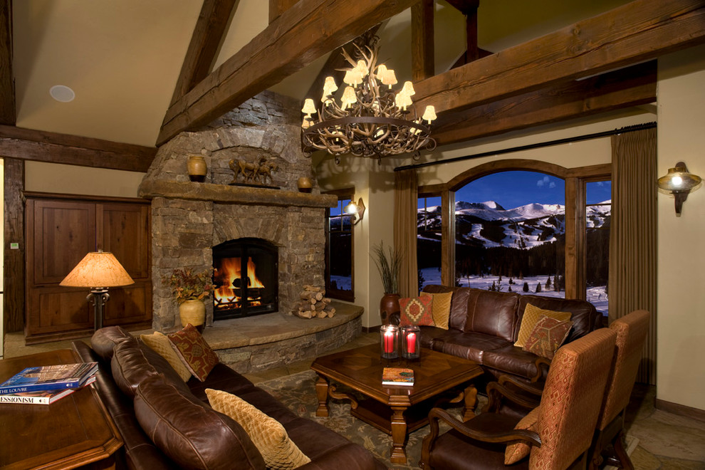 Inspiration for a timeless living room remodel in Denver with a stone fireplace