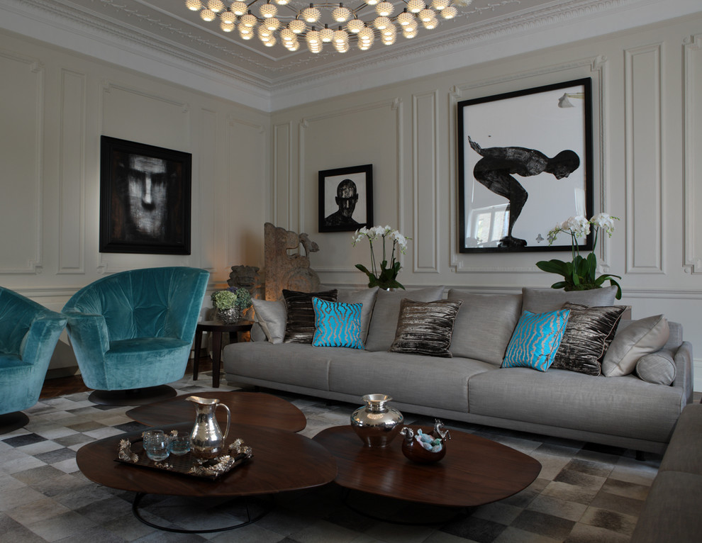 Inspiration for a contemporary grey and teal living room in London with beige walls and no tv.