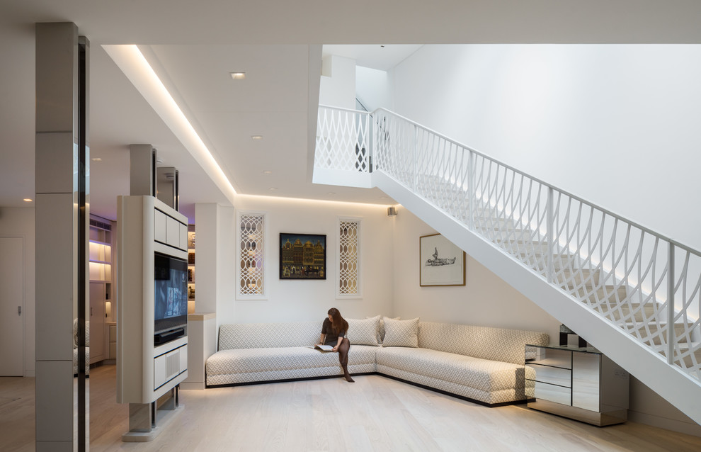 Medium sized modern living room in London with white walls.