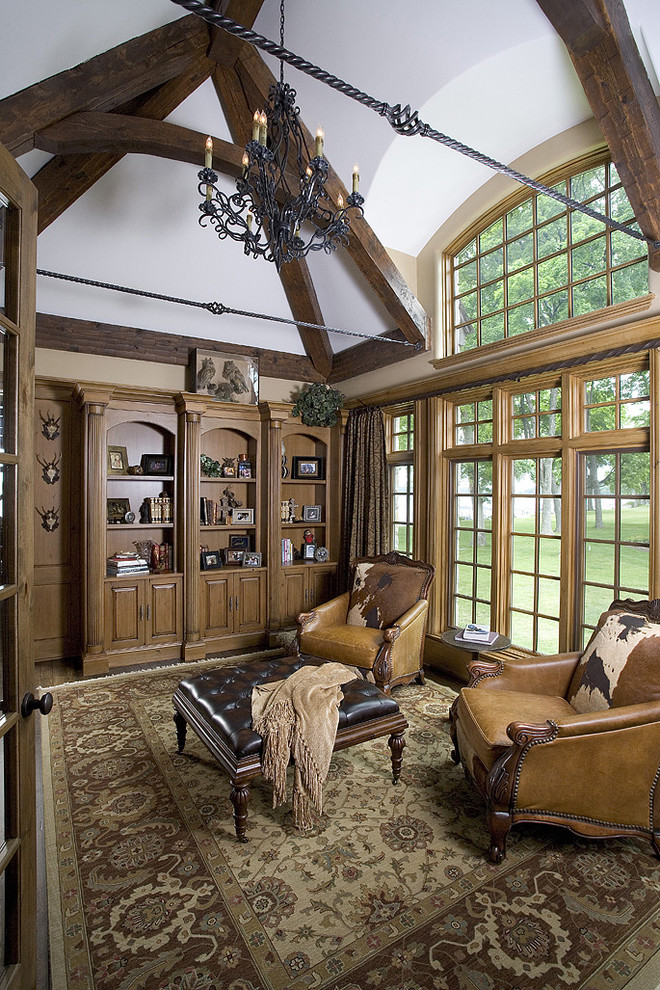 Living room library - huge traditional enclosed dark wood floor living room library idea in Chicago with white walls