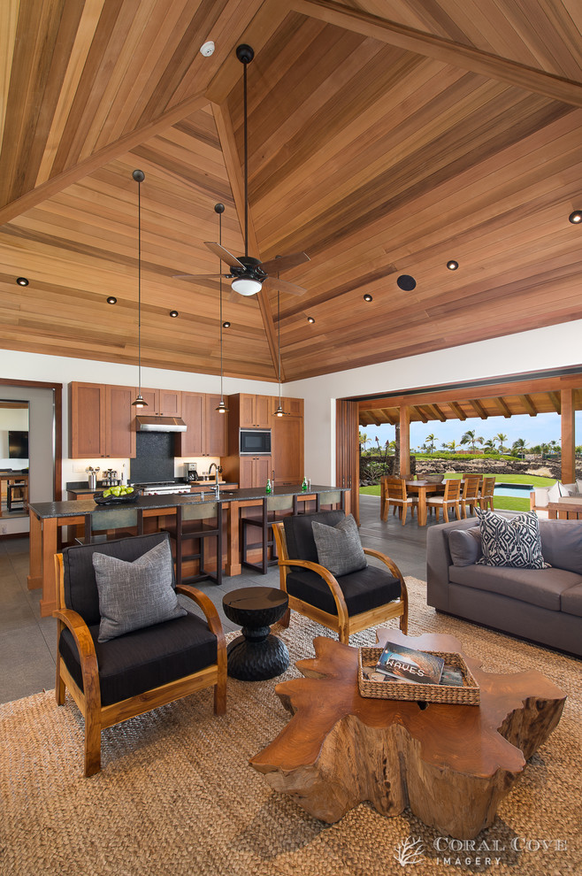 Living room - tropical open concept living room idea in Hawaii