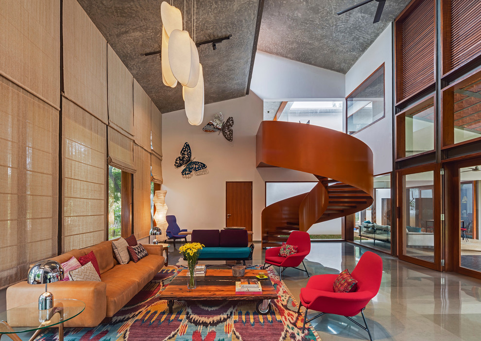 Living room - eclectic enclosed concrete floor living room idea in Bengaluru with white walls and no tv