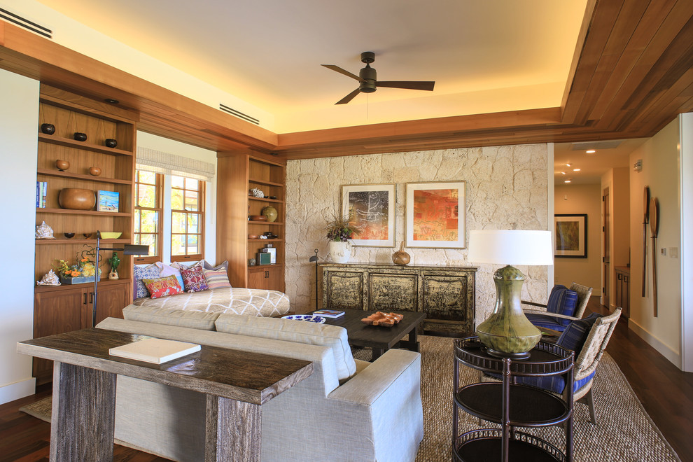 Living room - tropical open concept dark wood floor living room idea in Hawaii with beige walls