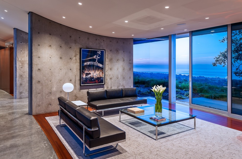 Свежая идея для дизайна: гостиная комната в стиле модернизм с бетонным полом - отличное фото интерьера