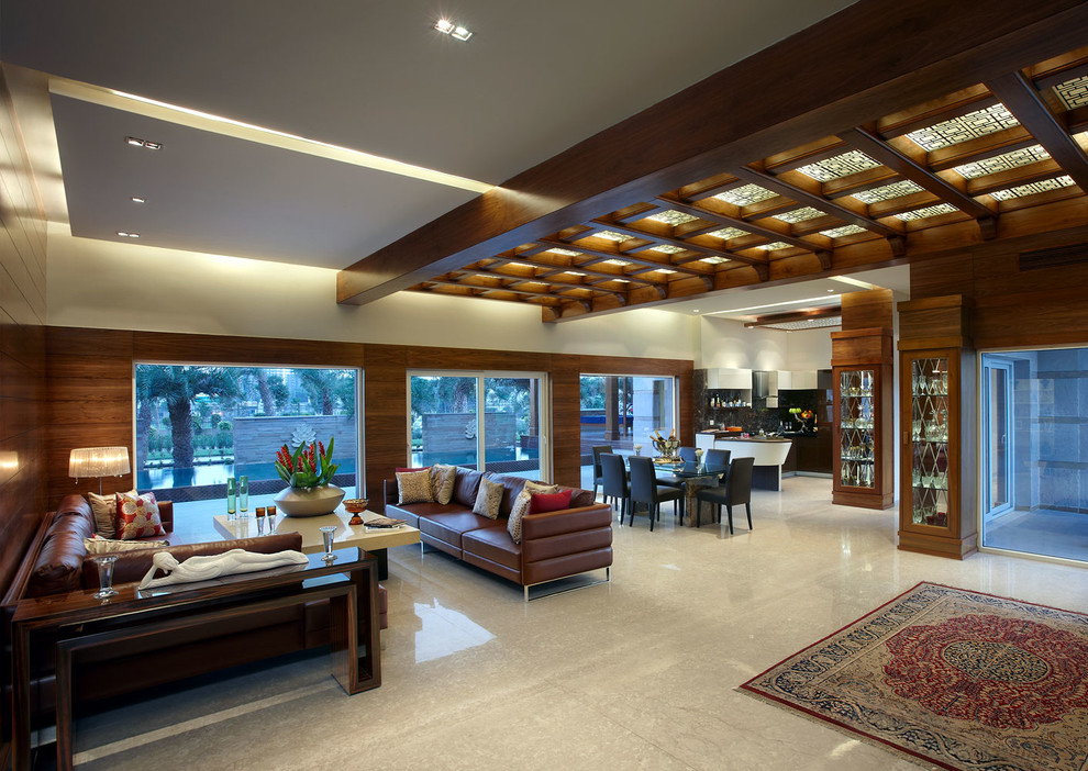 Design ideas for a contemporary living room in Pune with feature lighting.