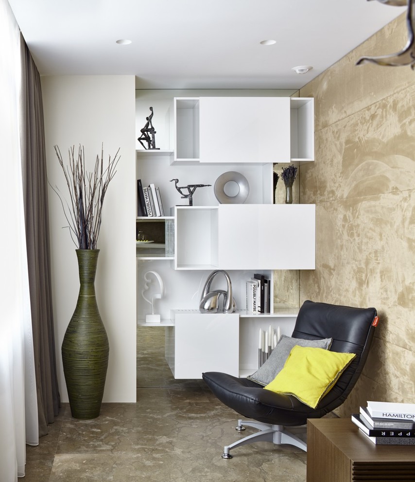 Exemple d'un salon tendance de taille moyenne et ouvert avec une bibliothèque ou un coin lecture et un mur beige.