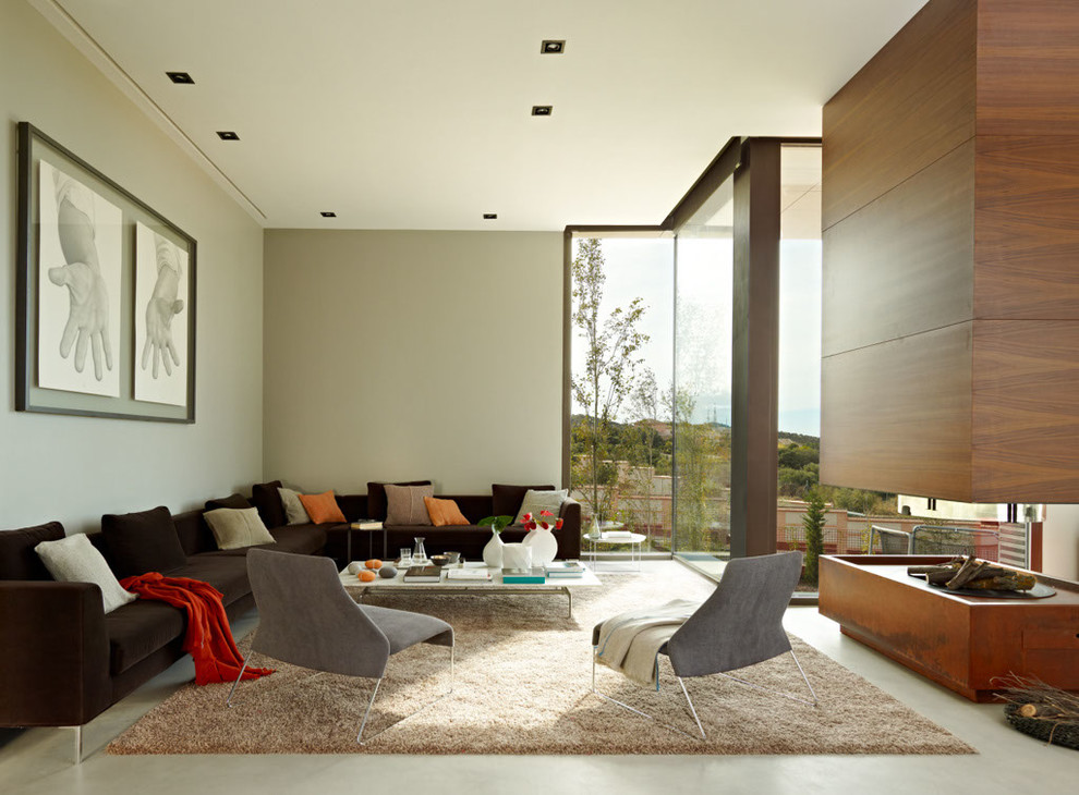 Ispirazione per un grande soggiorno design aperto con sala formale, camino bifacciale e nessuna TV