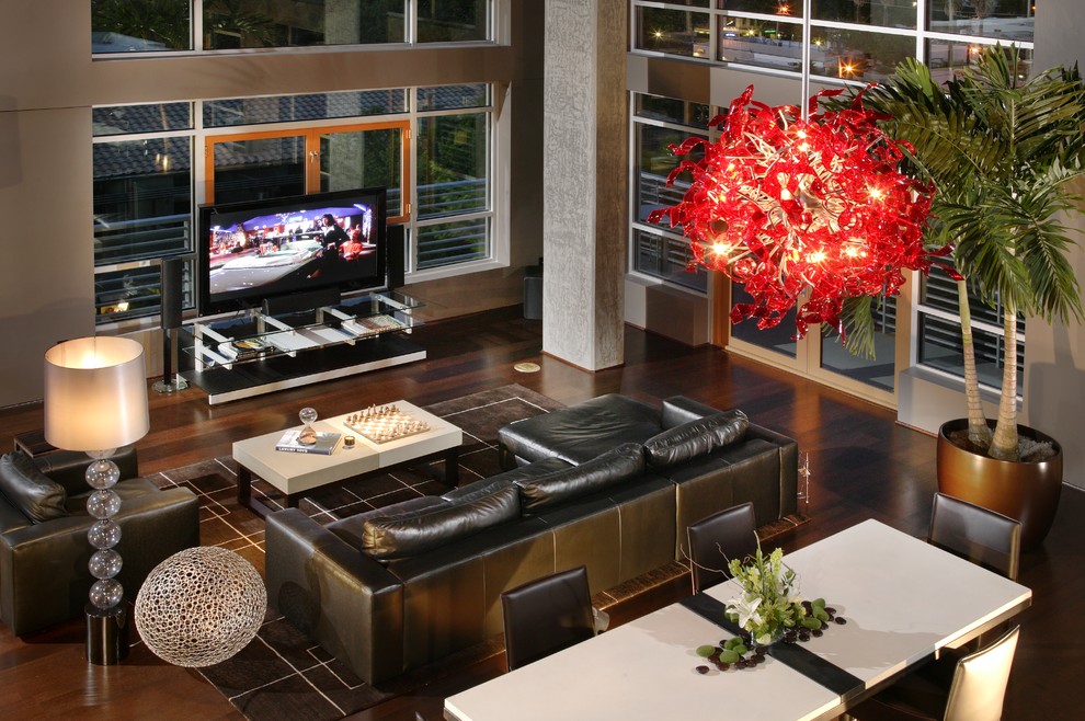 Idee per un soggiorno design aperto con TV autoportante e tappeto