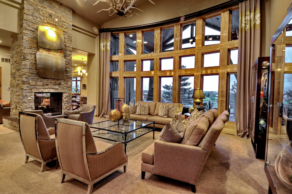 This is an example of a large rustic formal open plan living room curtain in Omaha with a two-sided fireplace, beige walls, carpet, a stone fireplace surround, no tv and beige floors.