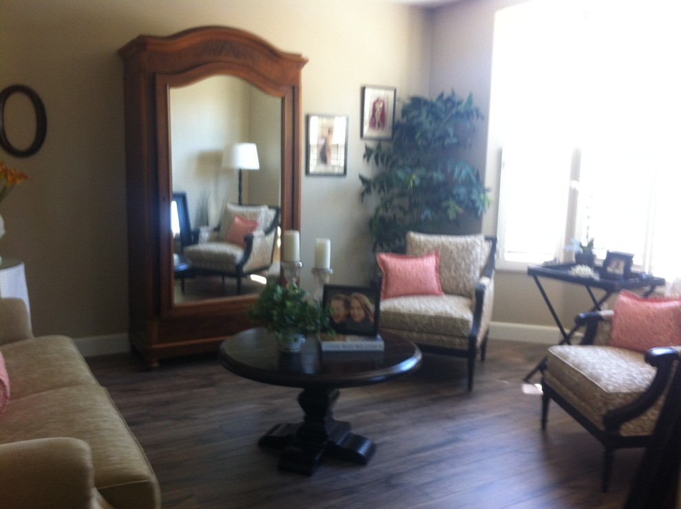 This is an example of a large classic living room in Phoenix with beige walls and dark hardwood flooring.