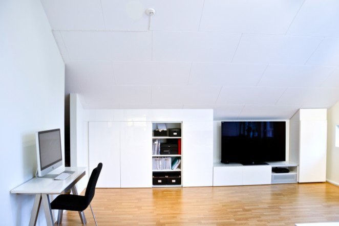 Inspiration for a medium sized contemporary open plan living room in Stockholm with white walls, light hardwood flooring and a freestanding tv.