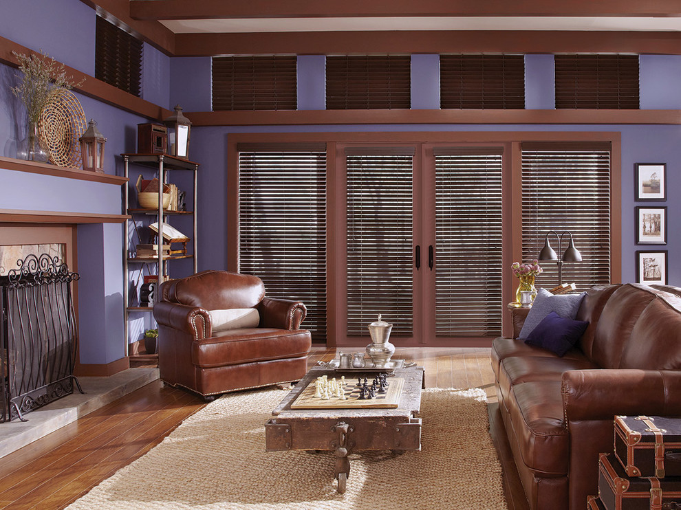 Inspiration for a mid-sized industrial formal and enclosed medium tone wood floor living room remodel in Chicago with purple walls, no fireplace and no tv
