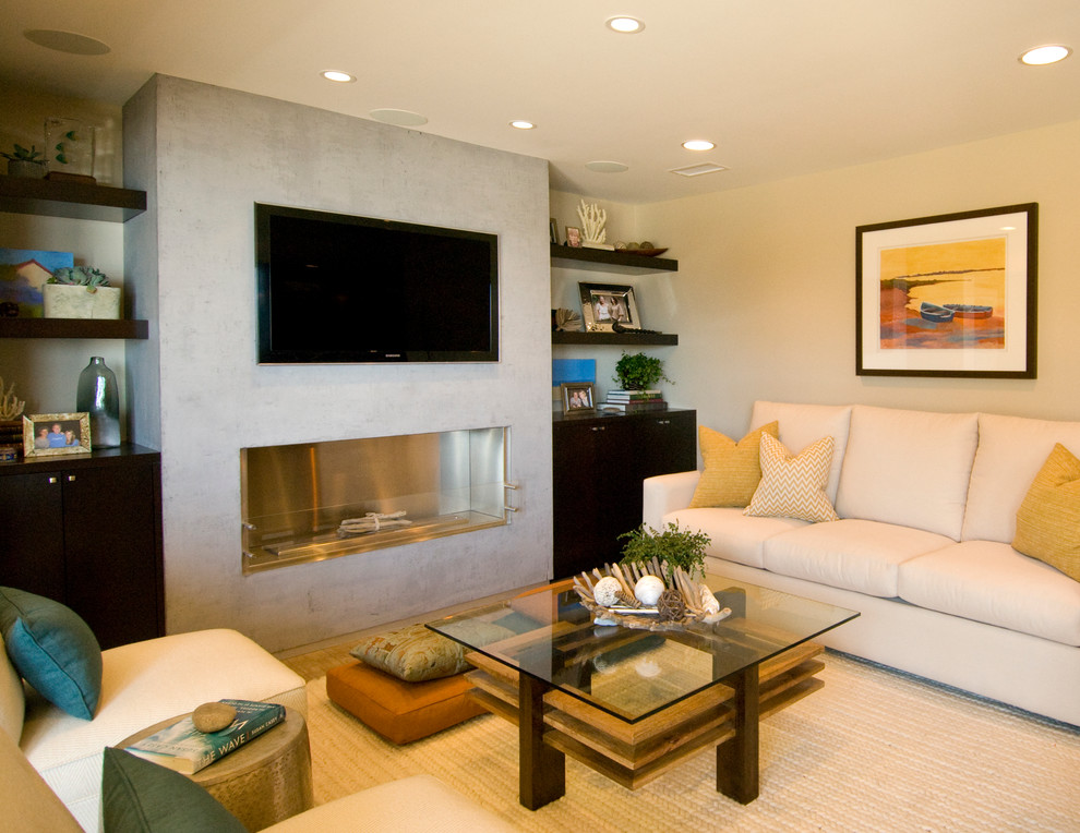 Example of a small transitional open concept porcelain tile living room design in Orange County with beige walls, a standard fireplace, a concrete fireplace and a wall-mounted tv