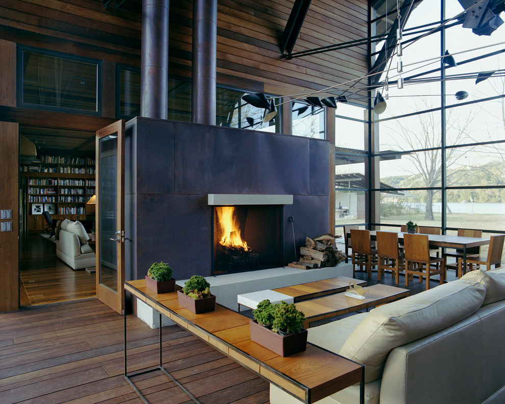Diseño de salón actual con marco de chimenea de metal