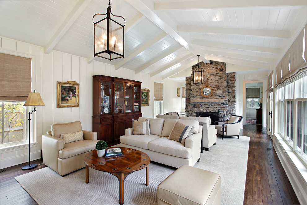 Large elegant living room photo in Chicago with white walls, a standard fireplace and a stone fireplace