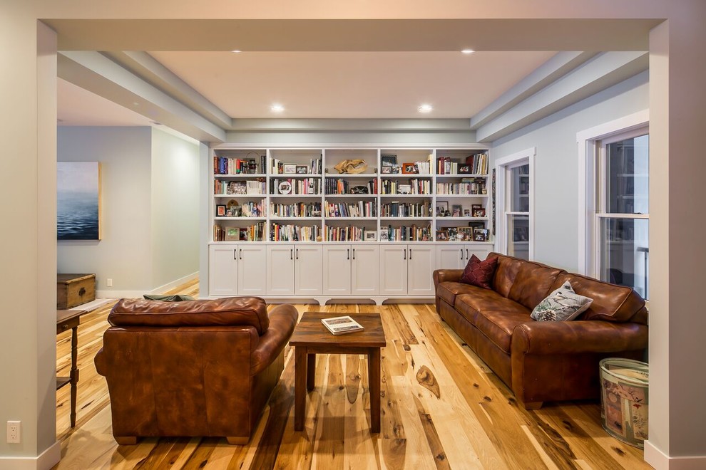Photo of a medium sized traditional open plan living room in Other with a reading nook, green walls, medium hardwood flooring and no tv.